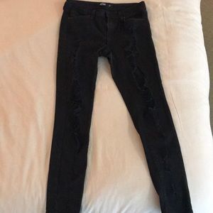 Distressed black denim jeans